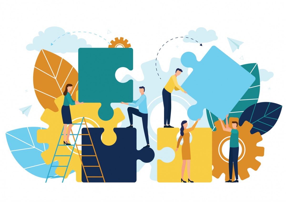 Illustrasjonsfoto. Illustrerte personer som stabler puslespillbiter.